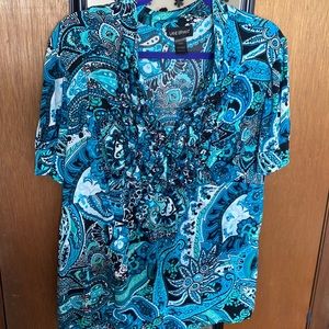 Beautiful blue blouse with ruffle details on the V neck. Size 18/20